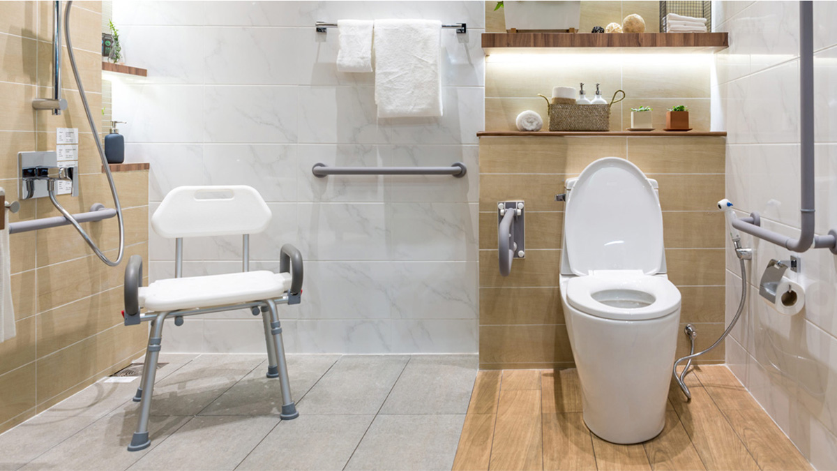 Adapted bathroom with grab rails and shower chair